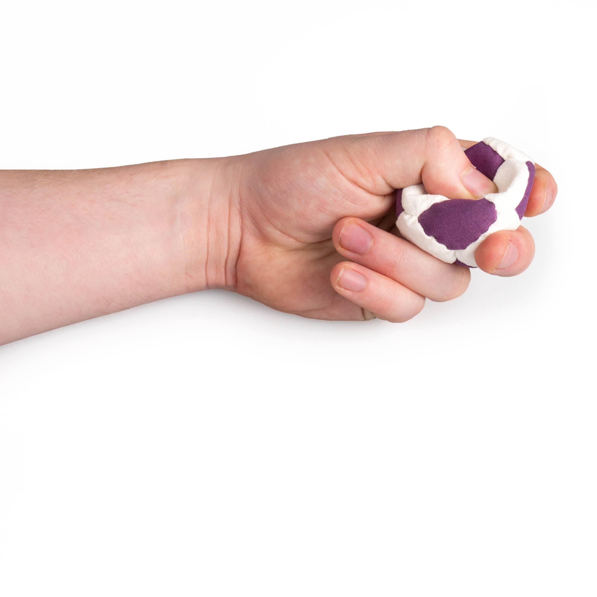 Purple and white hacky sack in hand being squeezed