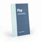 Play book at a slight angle on in a white background