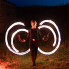 performer with fire poi