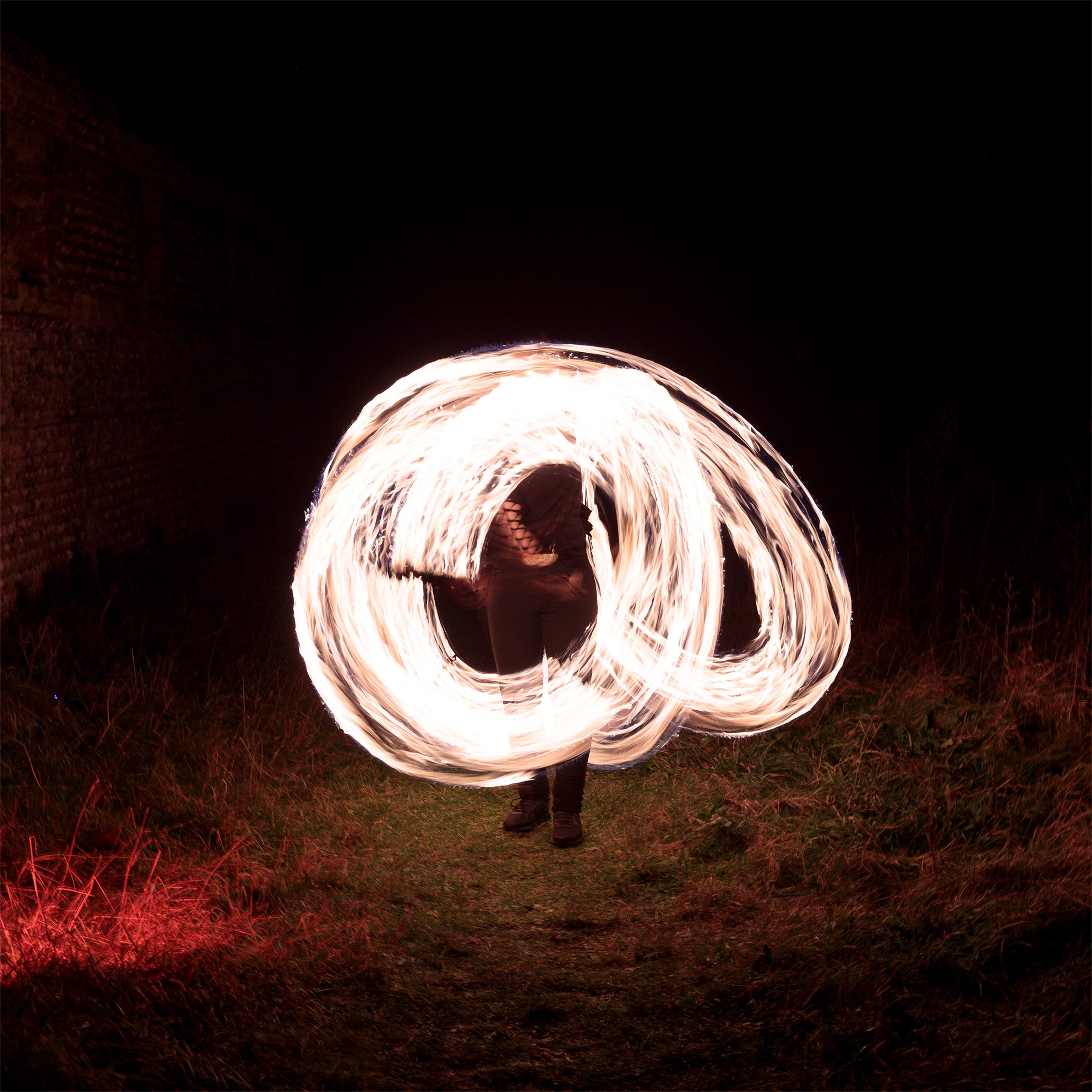 performer with fire poi