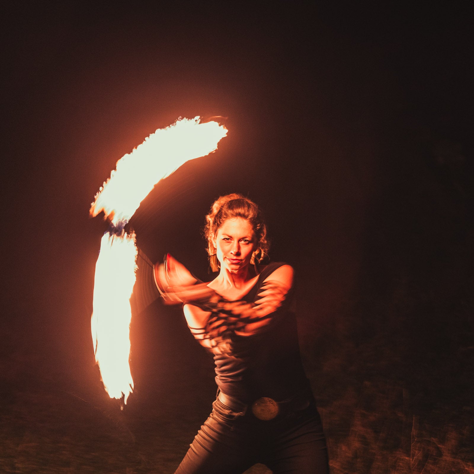 performer with fire poi