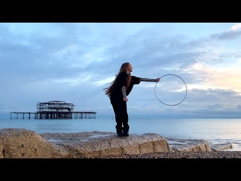 isolation hoop performed on a beach