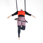 performer on shackle trapeze