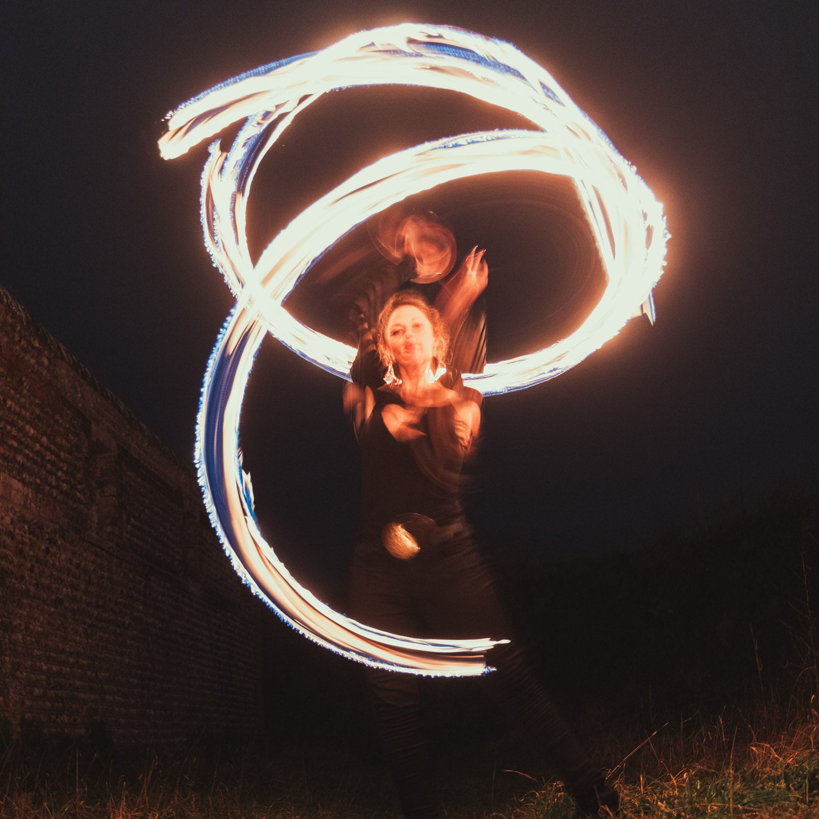 performer with fire poi